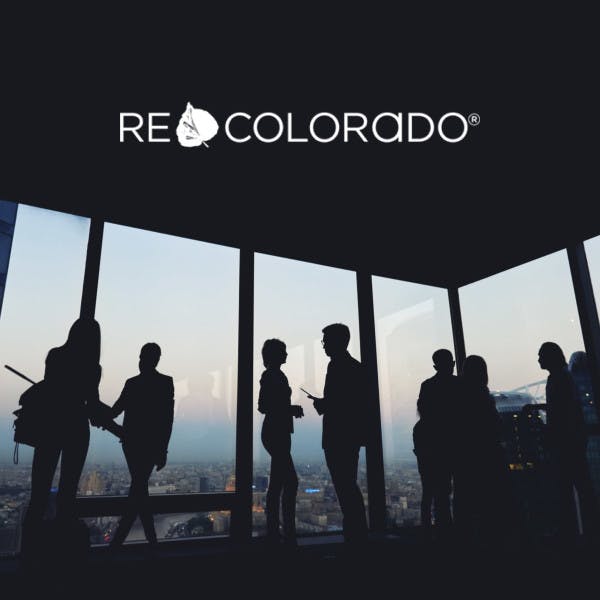 REcolorado logo and silhouettes of business people in a high-rise office building