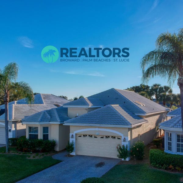 Broward Palm Beaches and St. Lucie Realtors logo and a Florida home with palm trees.