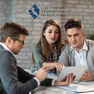 California Association of Realtors logo and a couple looking a contract with their real estate agent