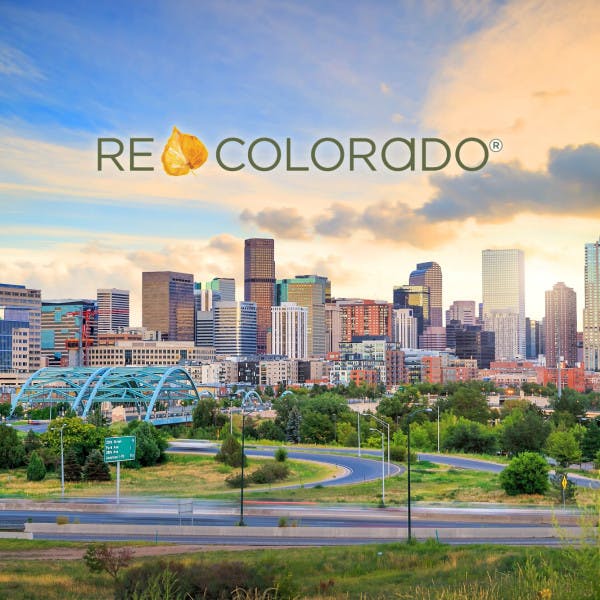 The REcolorado MLS logo and the Denver skyline