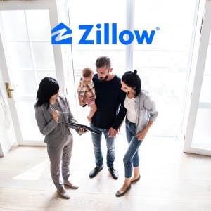 Zillow logo and a real estate agent showing a house to a couple and their baby.