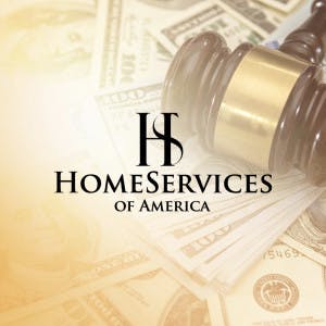 HomeServices of America logo and large bills next to a judge's gavel